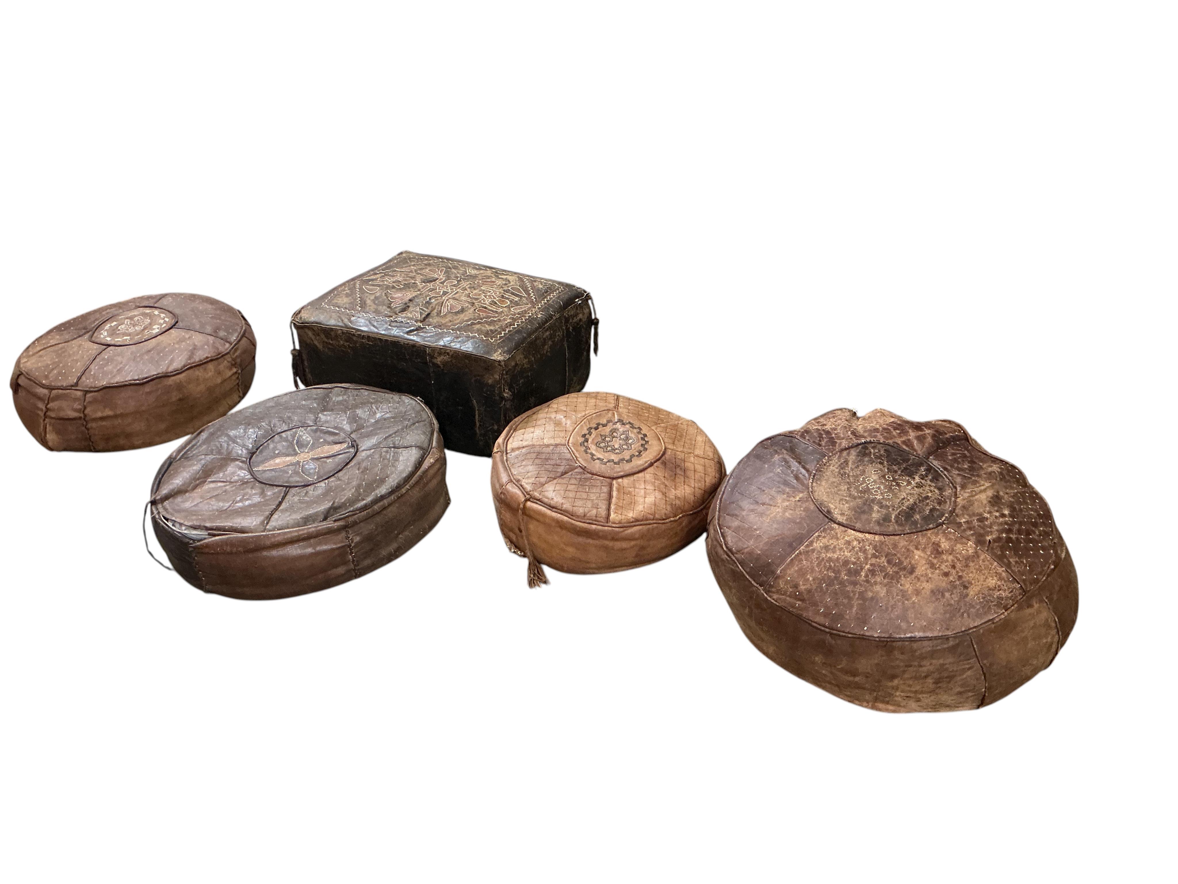 Five vintage Egyptian leather pouffe / footstools, largest diameter 60cm